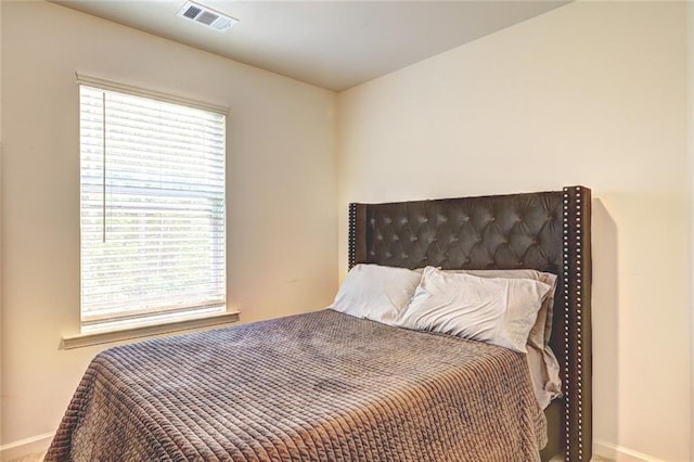 1005 Belfry Ter, Fairburn, GA 30213 - bedroom with multiple windows and baseboards