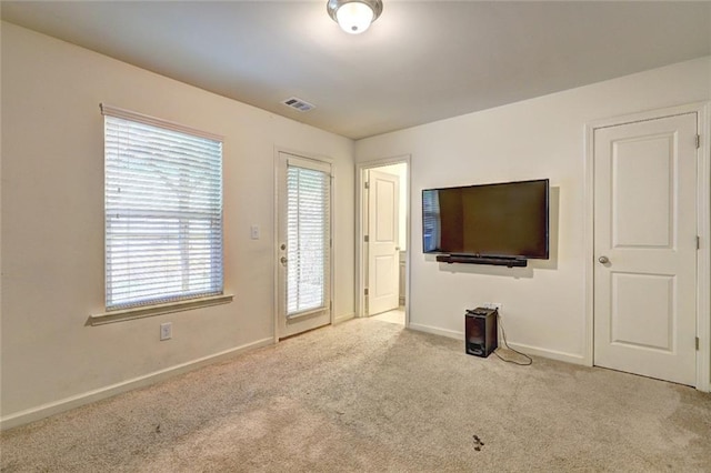 1005 Belfry Ter, Fairburn, GA 30213 - unfurnished living room featuring carpet flooring and baseboards