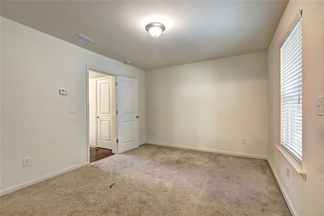 1005 Belfry Ter, Fairburn, GA 30213 - unfurnished room featuring carpet floors, baseboards, and healthy amount of natural light