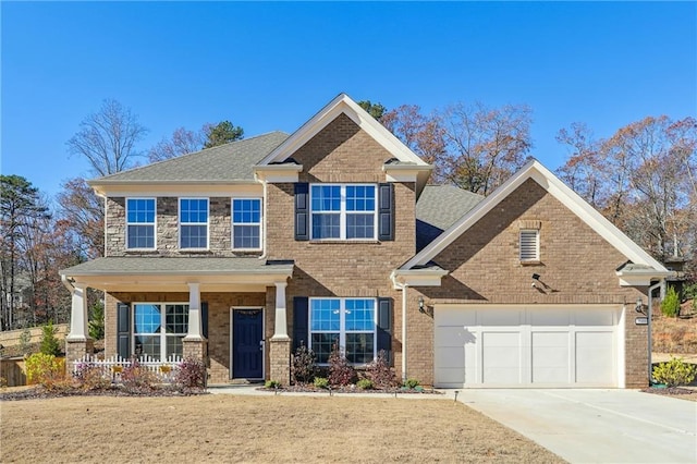 view of front of house with covered porch and a garage