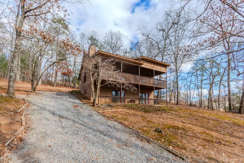 view of front facade with a wooden deck