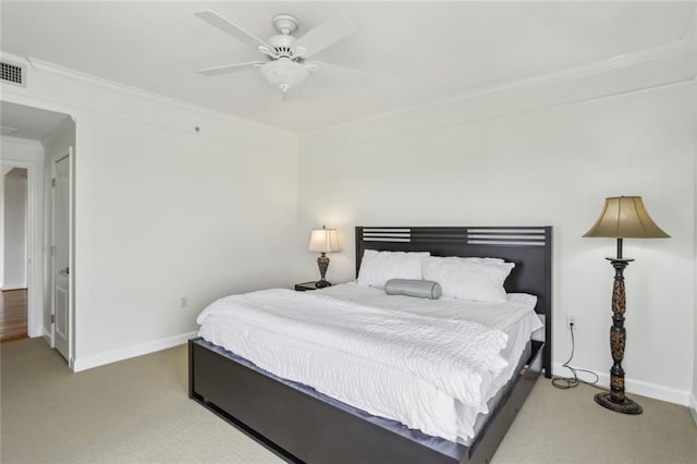 carpeted bedroom featuring crown molding, baseboards, ceiling fan, and visible vents