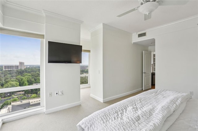 bedroom with carpet, visible vents, crown molding, a ceiling fan, and baseboards