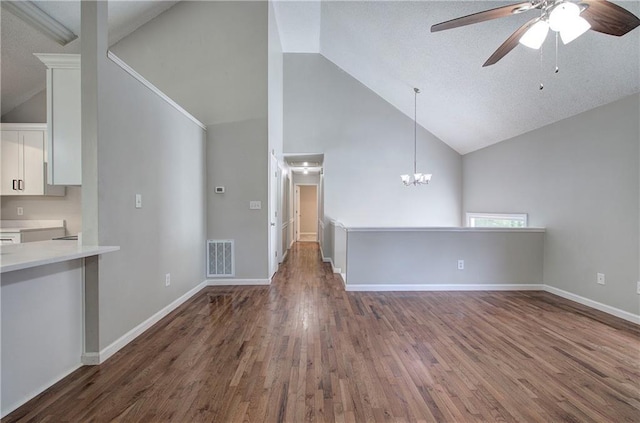 17 Fawn Ridge Dr SW, Cartersville, GA 30120 - unfurnished living room featuring high vaulted ceiling, a ceiling fan, wood finished floors, and a chandelier