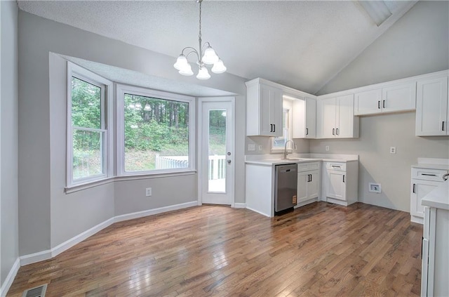 17 Fawn Ridge Dr SW, Cartersville, GA 30120 - kitchen featuring dishwasher, white cabinets, light wood finished floors, a chandelier, and light countertops