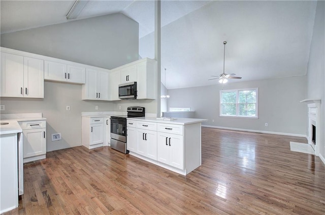 17 Fawn Ridge Dr SW, Cartersville, GA 30120 - kitchen with stainless steel appliances, ceiling fan, high vaulted ceiling, a peninsula, and open floor plan