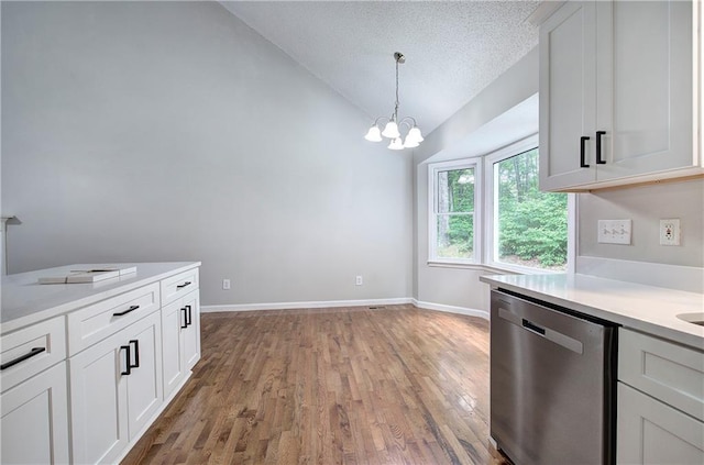 17 Fawn Ridge Dr SW, Cartersville, GA 30120 - kitchen featuring dishwasher, lofted ceiling, light countertops, light wood finished floors, and a chandelier