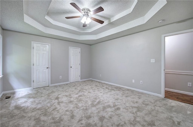 17 Fawn Ridge Dr SW, Cartersville, GA 30120 - unfurnished bedroom featuring a raised ceiling, carpet floors, a textured ceiling, and ceiling fan
