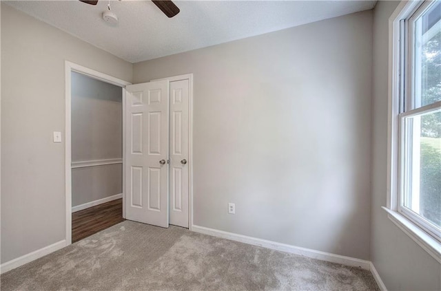 17 Fawn Ridge Dr SW, Cartersville, GA 30120 - unfurnished bedroom with carpet, a closet, and ceiling fan