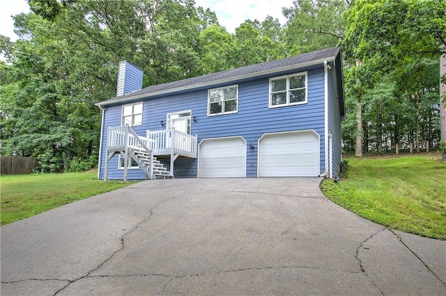 17 Fawn Ridge Dr SW, Cartersville, GA 30120 - raised ranch featuring a front lawn, a chimney, driveway, and a garage