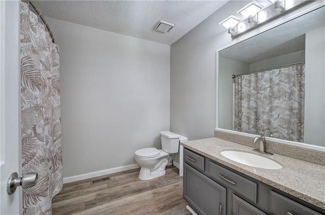 17 Fawn Ridge Dr SW, Cartersville, GA 30120 - full bathroom featuring wood finished floors, vanity, and a textured ceiling