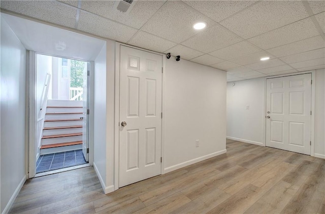 17 Fawn Ridge Dr SW, Cartersville, GA 30120 - below grade area with light wood-style floors, stairway, a paneled ceiling, and recessed lighting