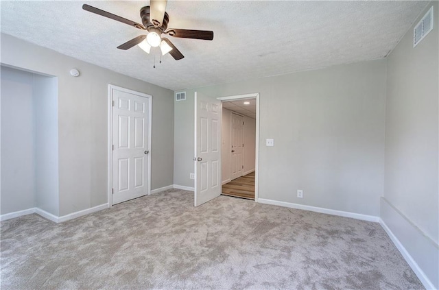 17 Fawn Ridge Dr SW, Cartersville, GA 30120 - unfurnished bedroom featuring a textured ceiling, carpet flooring, and a ceiling fan