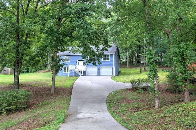 17 Fawn Ridge Dr SW, Cartersville, GA 30120 - split foyer home featuring stairway, concrete driveway, a garage, and a front lawn
