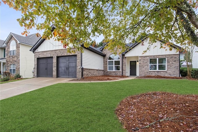 view of front of house with a garage and a front yard