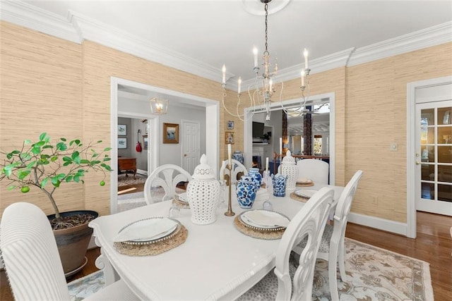 1374 Riverside Dr, Gainesville, GA 30501 - dining room featuring a chandelier, crown molding, baseboards, and wood finished floors