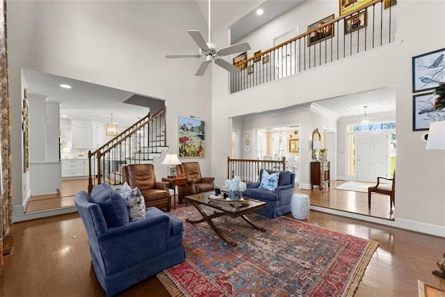 1374 Riverside Dr, Gainesville, GA 30501 - living room with a towering ceiling, wood finished floors, stairway, ceiling fan, and baseboards