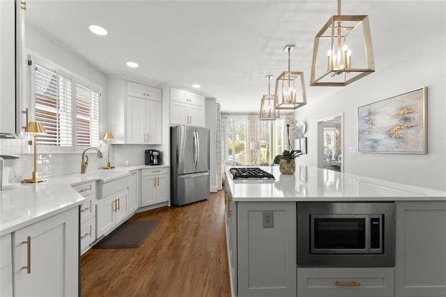 1374 Riverside Dr, Gainesville, GA 30501 - kitchen with stainless steel appliances, a sink, healthy amount of natural light, dark wood-type flooring, and recessed lighting