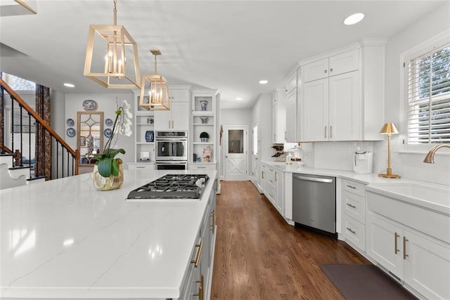 1374 Riverside Dr, Gainesville, GA 30501 - kitchen featuring appliances with stainless steel finishes, open shelves, a sink, white cabinetry, and dark wood finished floors