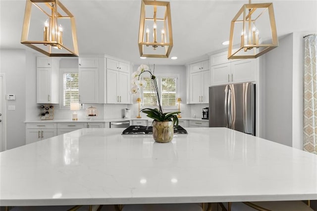 1374 Riverside Dr, Gainesville, GA 30501 - kitchen featuring stainless steel appliances, a chandelier, a large island, decorative backsplash, and recessed lighting