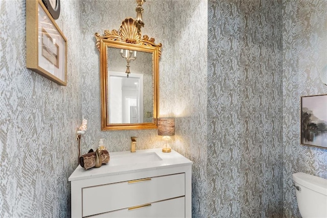 1374 Riverside Dr, Gainesville, GA 30501 - bathroom featuring toilet, wallpapered walls, and vanity