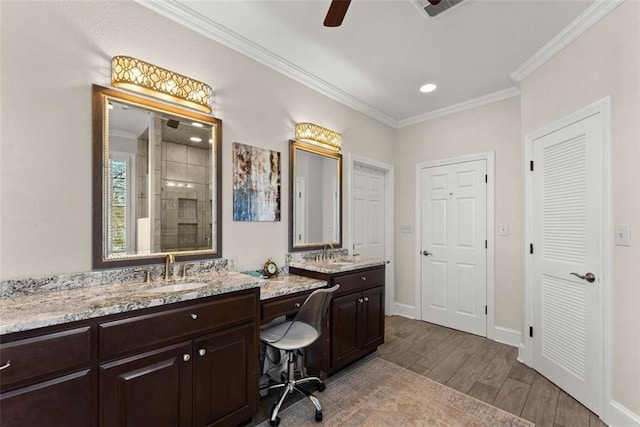 1374 Riverside Dr, Gainesville, GA 30501 - bathroom with wood finished floors, a tile shower, crown molding, ceiling fan, and vanity