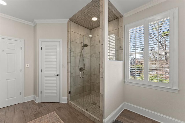 1374 Riverside Dr, Gainesville, GA 30501 - bathroom with wood finished floors, healthy amount of natural light, a shower stall, baseboards, and ornamental molding