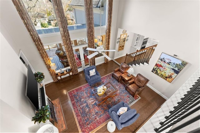 1374 Riverside Dr, Gainesville, GA 30501 - living area featuring a towering ceiling, baseboards, wood finished floors, and stairway