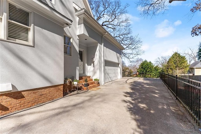 1374 Riverside Dr, Gainesville, GA 30501 - view of property exterior with stucco siding and driveway