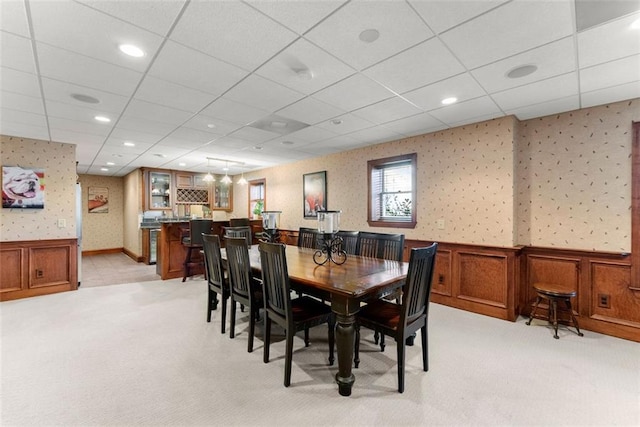 1374 Riverside Dr, Gainesville, GA 30501 - dining area featuring light carpet, wallpapered walls, a wainscoted wall, a drop ceiling, and bar area