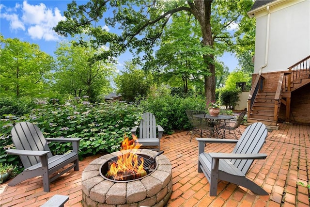 1374 Riverside Dr, Gainesville, GA 30501 - view of patio with an outdoor fire pit and stairway
