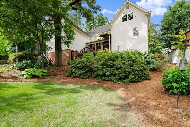 1374 Riverside Dr, Gainesville, GA 30501 - rear view of house with stucco siding, a yard, stairway, and a wooden deck