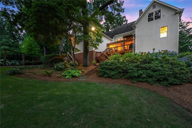 1374 Riverside Dr, Gainesville, GA 30501 - yard at dusk featuring stairs, a yard, and a deck