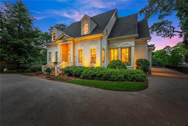 1374 Riverside Dr, Gainesville, GA 30501 - view of front of house featuring stucco siding, a shingled roof, and driveway