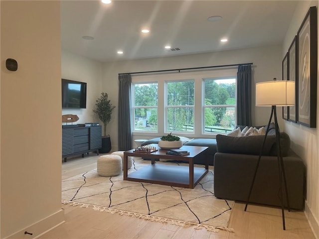 living room with light hardwood / wood-style floors