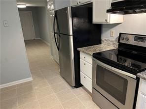 kitchen featuring light stone countertops, white cabinetry, exhaust hood, and appliances with stainless steel finishes