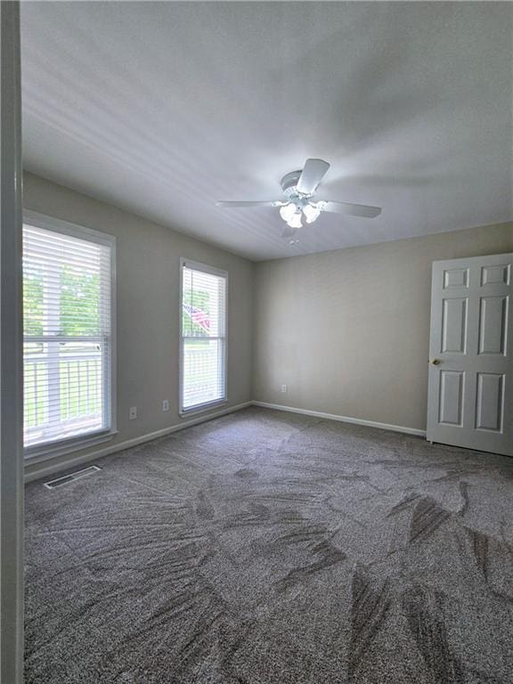 half bathroom featuring baseboards, wood tiled floor, toilet, and vanity