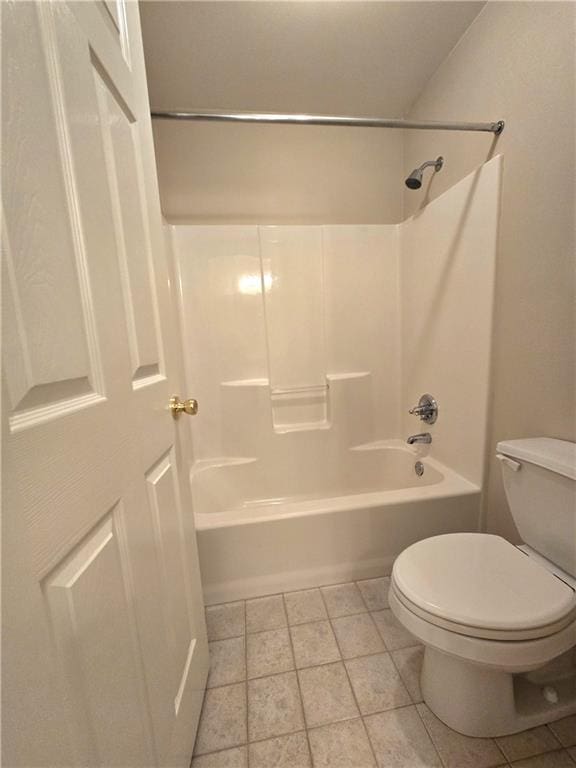 full bath with tile patterned floors, toilet, and shower / bathtub combination