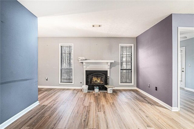 unfurnished living room featuring hardwood / wood-style flooring