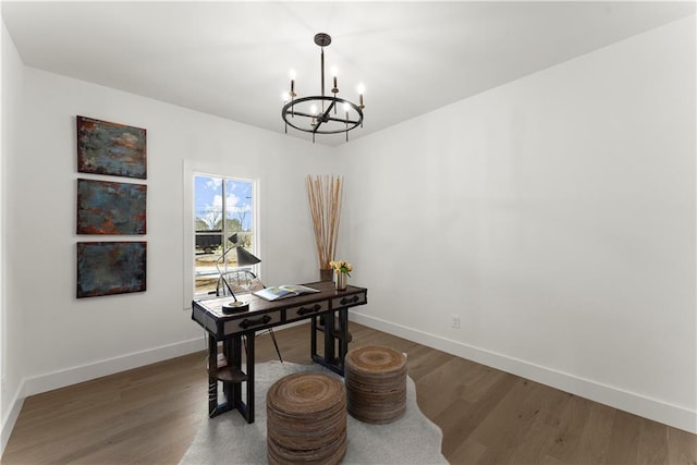 office with a chandelier, baseboards, and wood finished floors