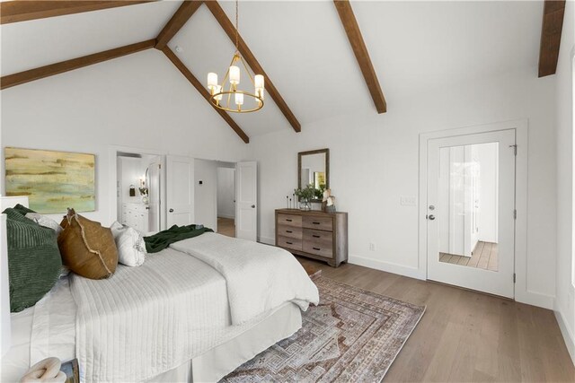 bedroom with beamed ceiling, high vaulted ceiling, an inviting chandelier, and wood finished floors