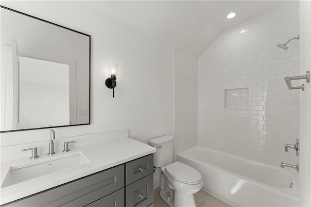 bathroom featuring vanity, recessed lighting, vaulted ceiling, toilet, and shower / bathtub combination