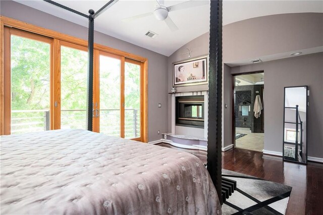 1216 E Rock Springs Rd NE, Atlanta, GA 30306 - bedroom with wood finished floors, access to outside, vaulted ceiling, baseboards, and a fireplace