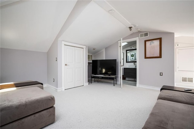 1216 E Rock Springs Rd NE, Atlanta, GA 30306 - living area featuring baseboards, vaulted ceiling, and light carpet
