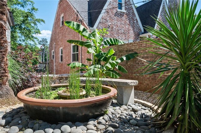 1216 E Rock Springs Rd NE, Atlanta, GA 30306 - view of home's exterior with brick siding and a shingled roof