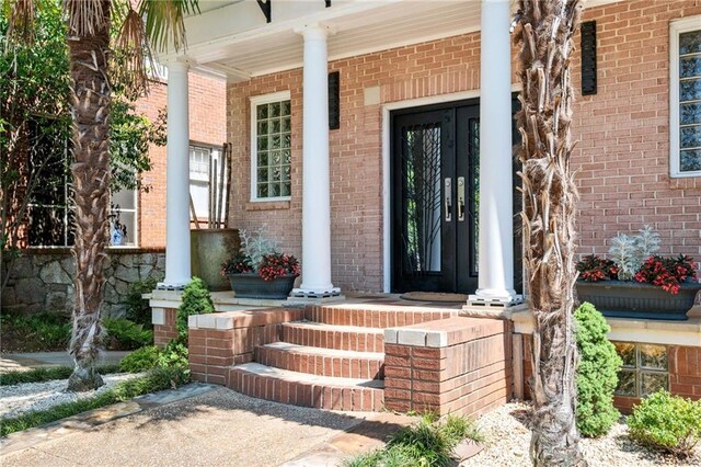 1216 E Rock Springs Rd NE, Atlanta, GA 30306 - property entrance featuring covered porch and brick siding