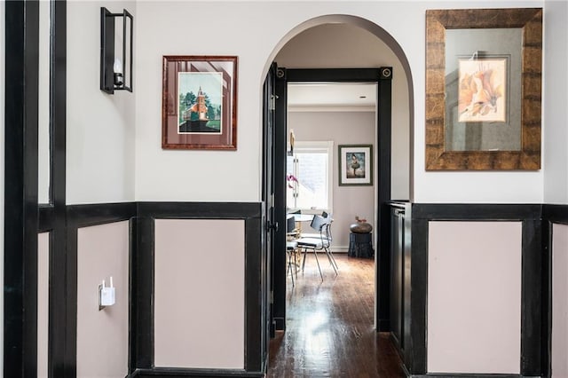 1216 E Rock Springs Rd NE, Atlanta, GA 30306 - corridor featuring dark wood-type flooring, crown molding, arched walkways, and a wainscoted wall