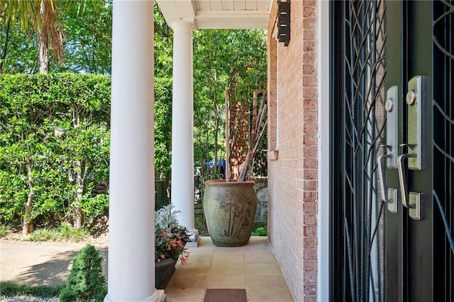 1216 E Rock Springs Rd NE, Atlanta, GA 30306 - doorway to property featuring covered porch and brick siding