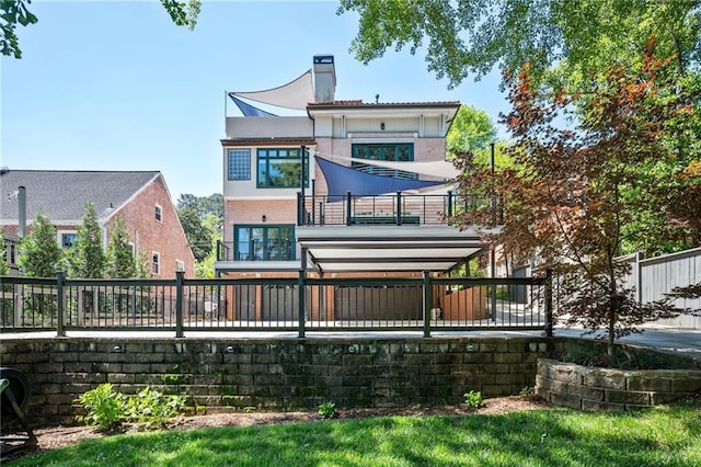 1216 E Rock Springs Rd NE, Atlanta, GA 30306 - rear view of property with a balcony, a chimney, a fenced backyard, and stucco siding