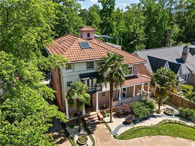 1216 E Rock Springs Rd NE, Atlanta, GA 30306 - view of front of home featuring a tile roof, stucco siding, and a balcony